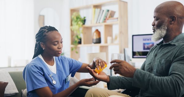 assisted-living-healthcare-nurse-giving-patient-medication