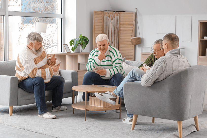Seniors playing cards at a table